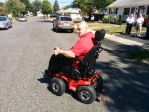 Roy Sherman takes his new all terrain wheelchair for a spin.